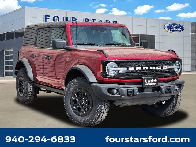 2026 Ford Bronco Badlands in Ruby Red Metallic — front three-quarter view